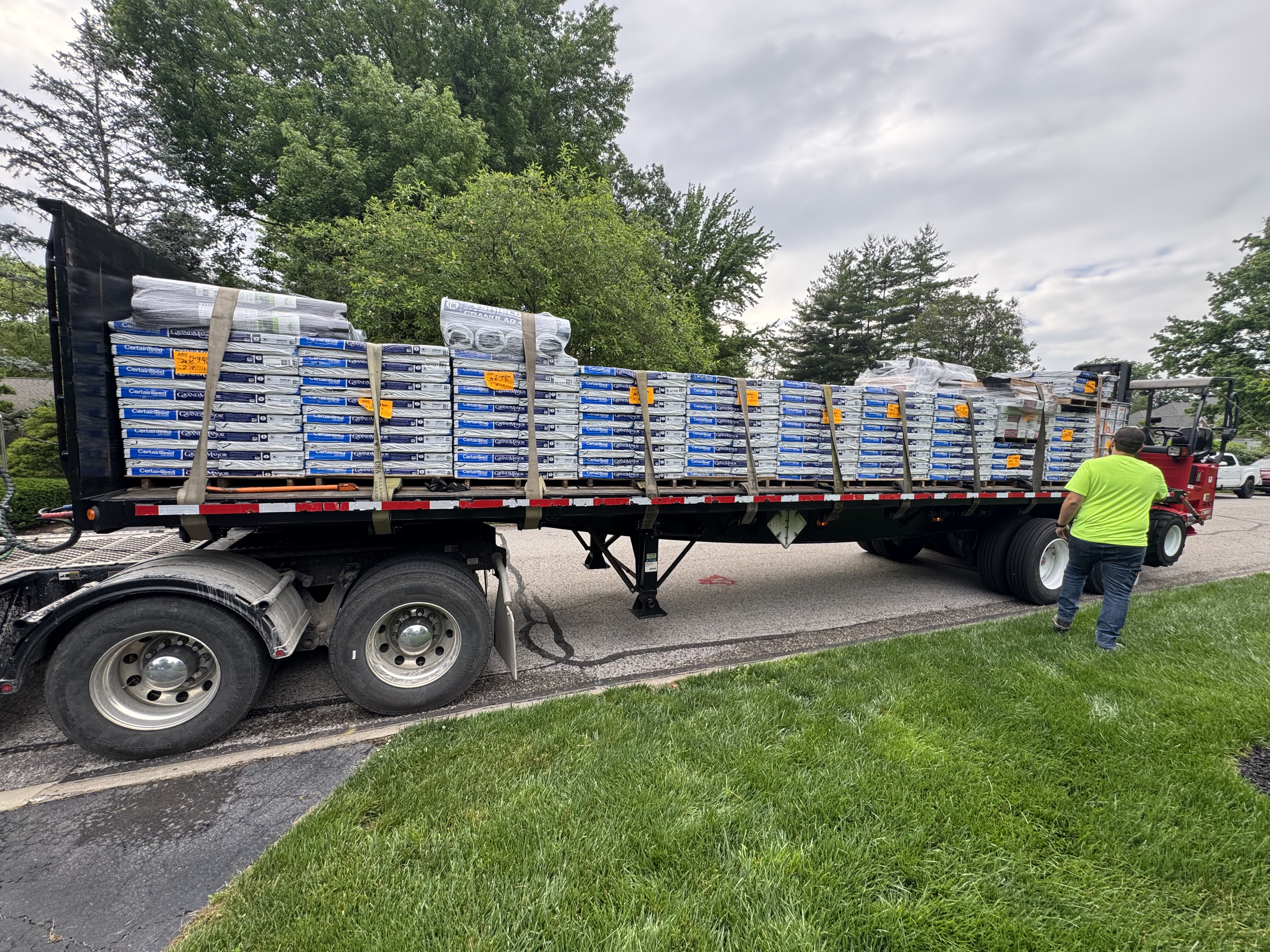 Materials delivery for Belmont Construction roofing project